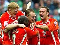 Blackpool celebrate their first goal in a 2-0 win