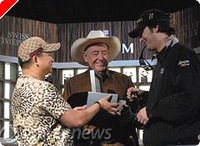 Hellmuth receiving the bracelet from Brunson and Chan